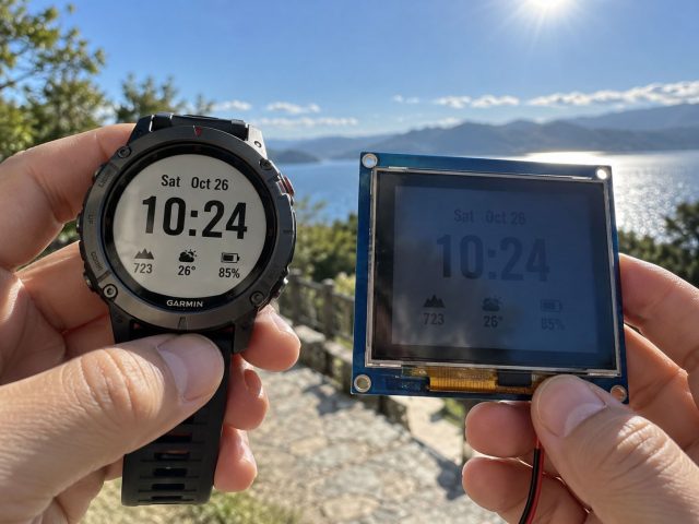 Memory-in-pixel display beside a backlit TFT LCD module showing the same content in direct sunlight